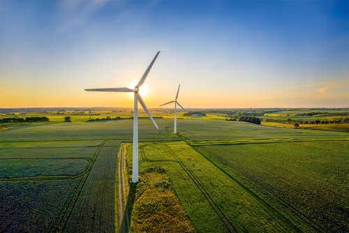 Wind turbines that produce electricity, built on a field in Skanderborg, Denmark