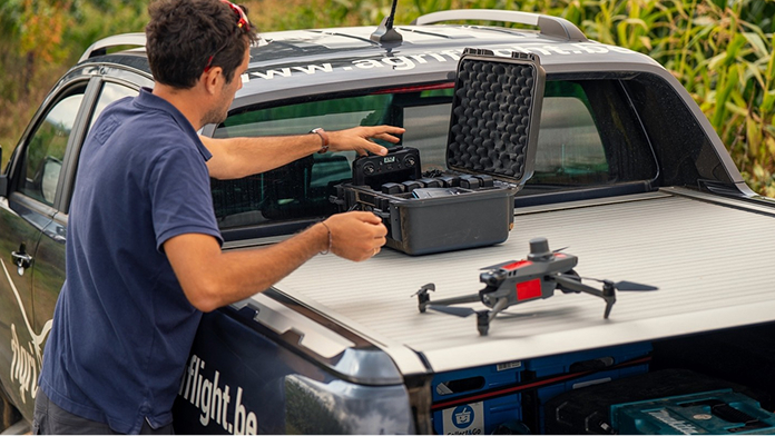 Agriflight drone with man activating it